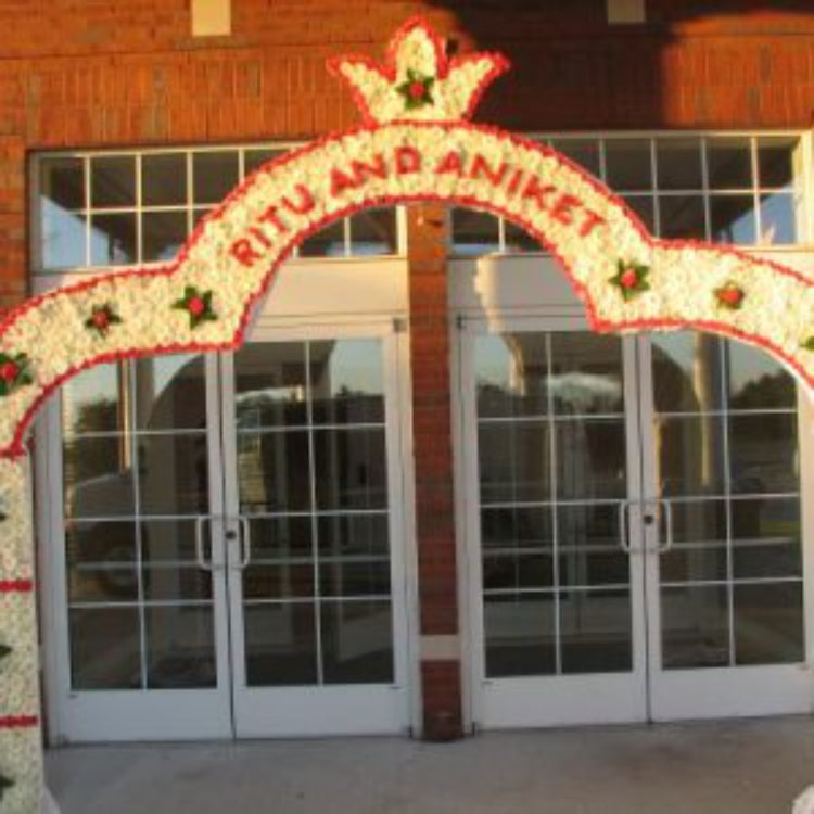 Large Entrance Arch With Flowers on One Side